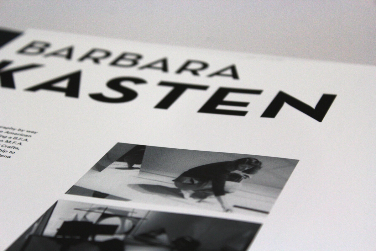 Closeup of artist book of Barbara Kasten featuring some work in progress photos of Barbara in her studio.